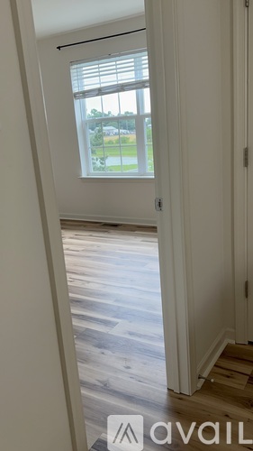 A white door with a window above it.