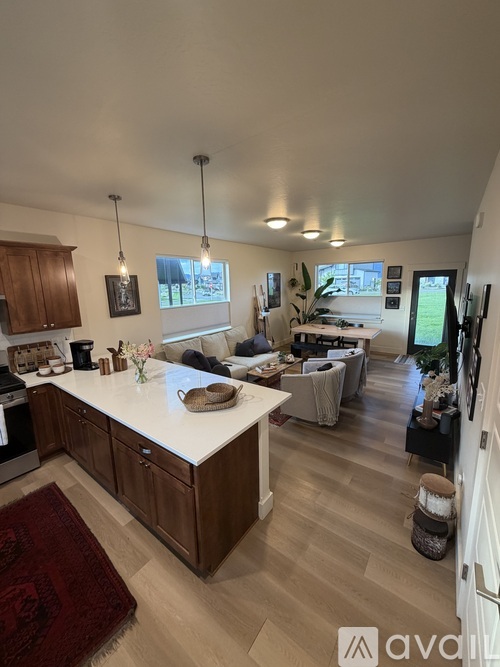 A kitchen with wooden cabinets and a white countertop.