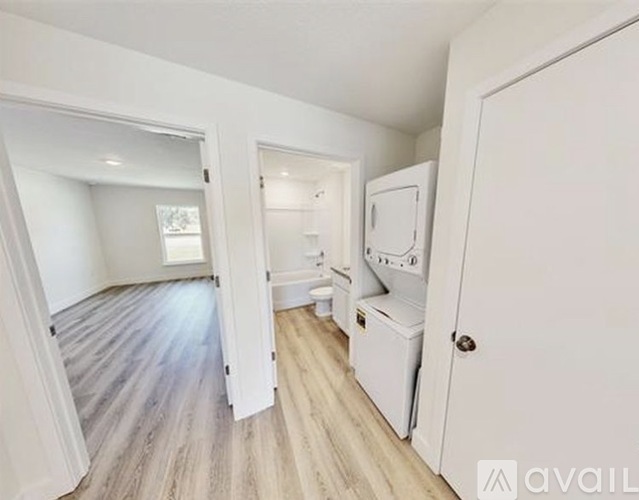 A small, empty room with a washer and dryer.