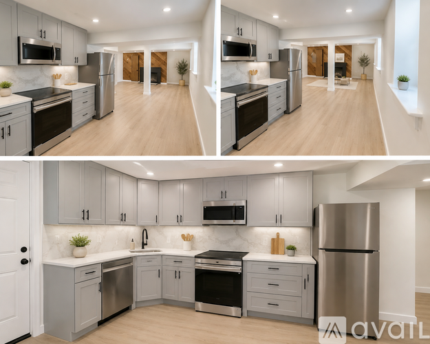 A modern kitchen with stainless steel appliances and wooden floors.