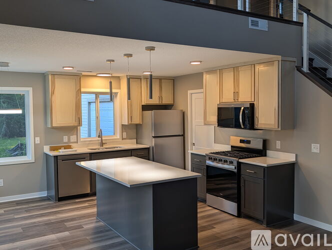A modern kitchen with a large island in the center.