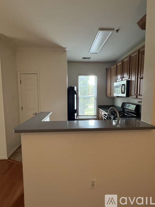 A kitchen with a counter and cabinets.