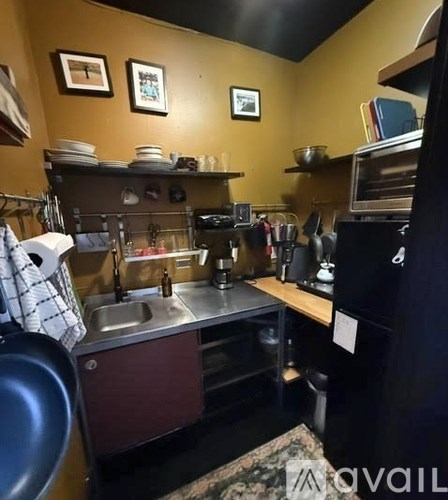 A kitchen with a sink and a counter.
