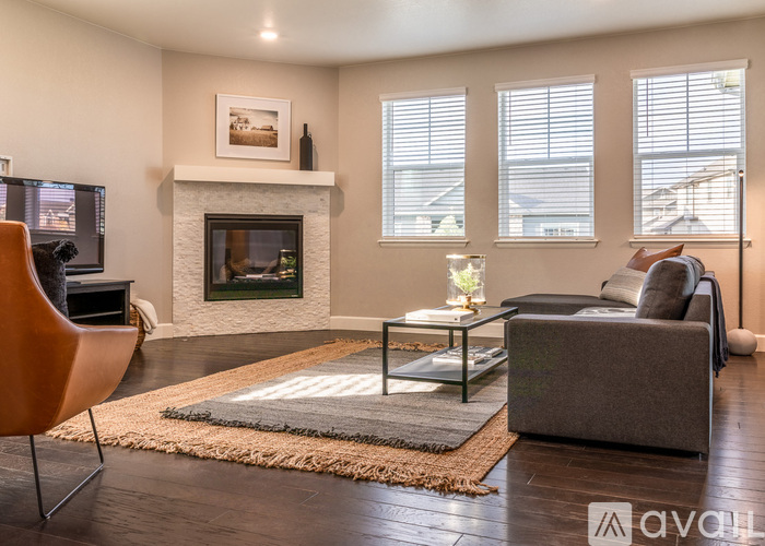 A living room with a fireplace and a couch.