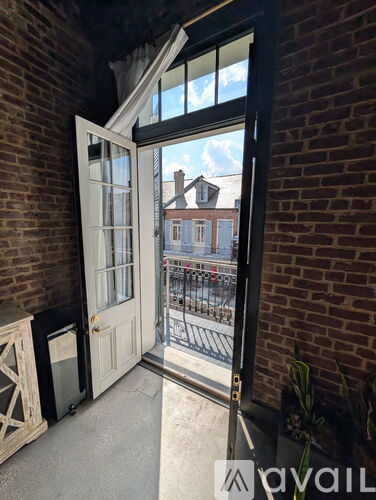 A view from inside a building looking out through a glass door.