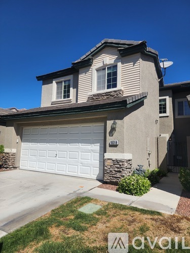A house with a white garage door is for sale.