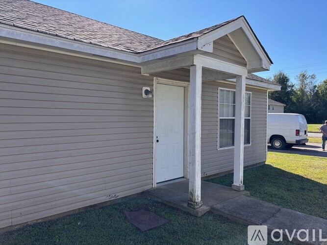 A house with a white door and a porch.