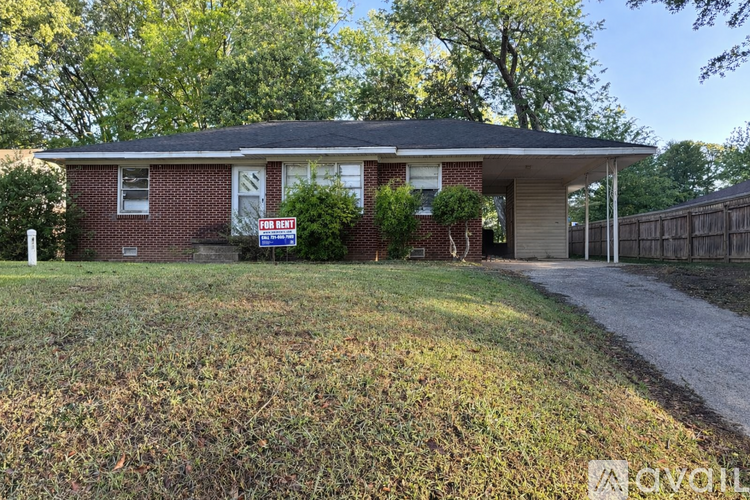 A house with a yard is for sale.