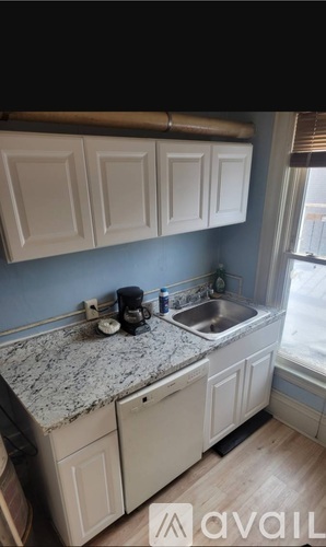 A kitchen with a sink and cabinets.