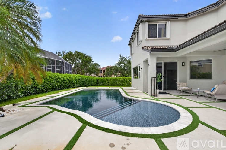 A house with a pool in the backyard.