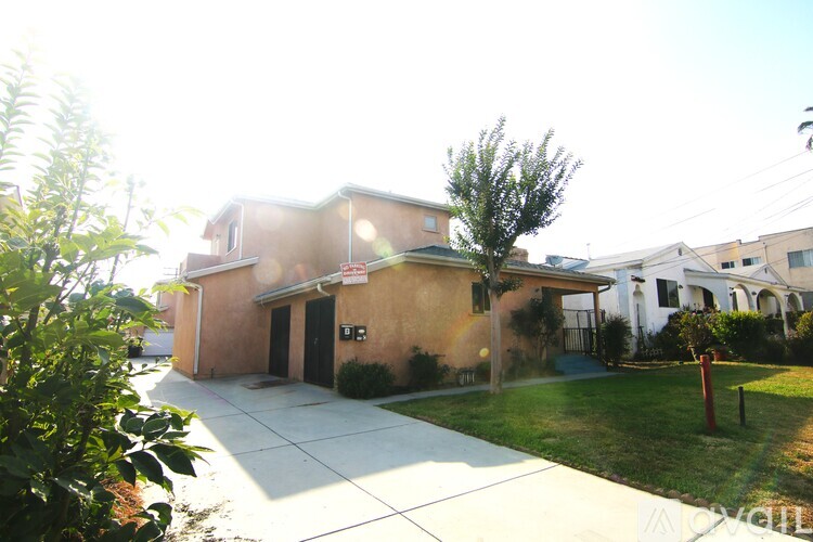 A house with a brown exterior and a white roof.