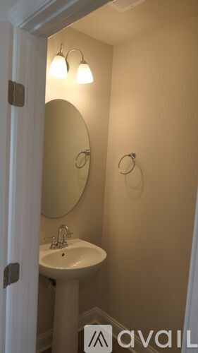A bathroom with a sink and mirror.