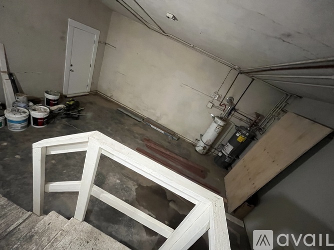 A room with a white door and a white window frame.