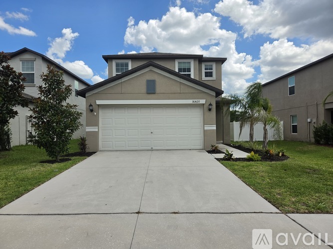 A house with a garage is for sale.