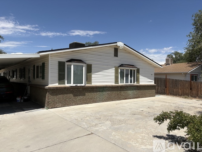 A house with a garage and a driveway.