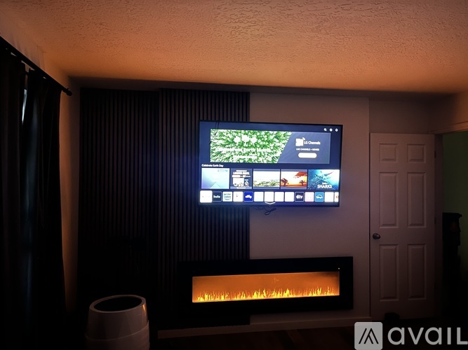 A television screen is on in a dark room.