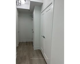A white door with a handle and a small window above it.