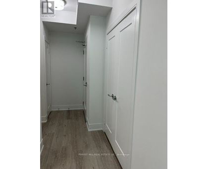 A white door with a handle and a small window above it.