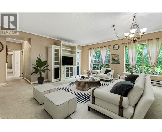 A living room with a white couch and a coffee table.