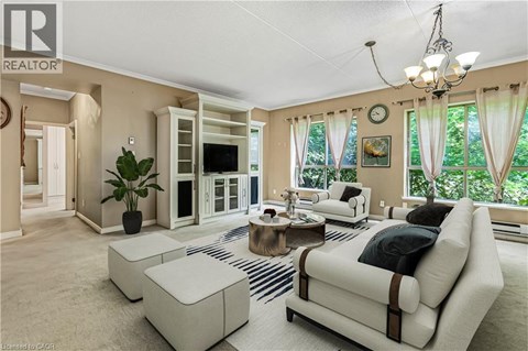 A living room with a white couch and a coffee table.
