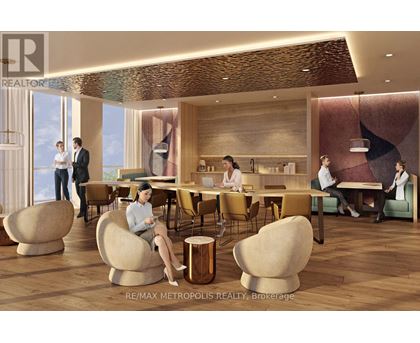 A modern dining room with a woman sitting at a table.