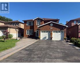 A house with a driveway in front of it.
