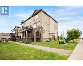A building with a balcony is part of a residential complex.