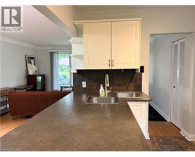 A kitchen with a sink and cabinets.