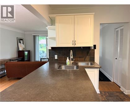 A kitchen with a sink and cabinets.