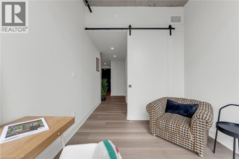 A living room with a couch and a chair.