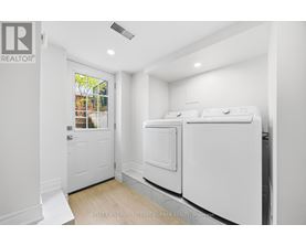 A laundry room with a washer and dryer.
