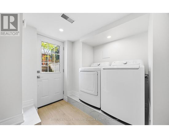 A laundry room with a washer and dryer.