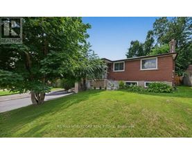 A house with a lawn in front of it is for sale.