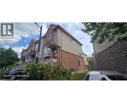 A house with a red brick exterior and a garage door numbered 32.