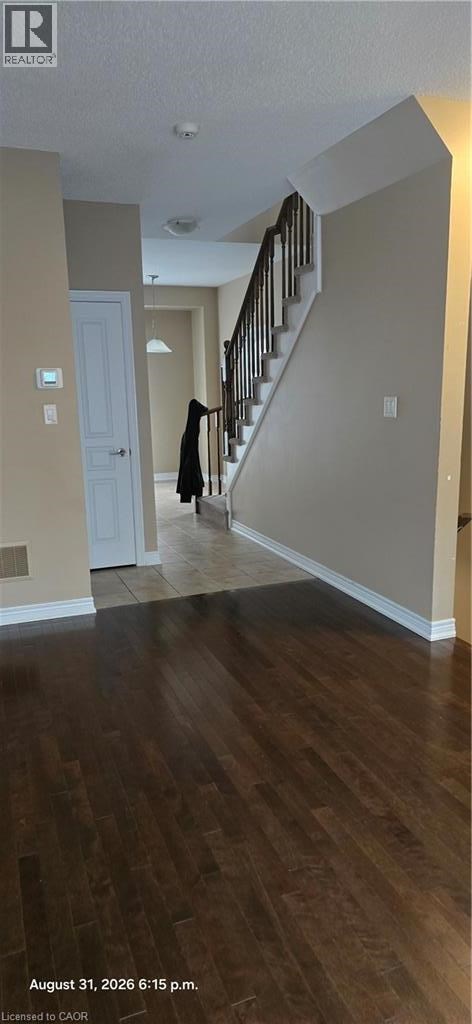 A person is walking up a staircase in a house.