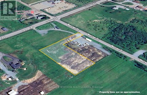 An aerial view of a property with a yellow square highlighting a section of land.