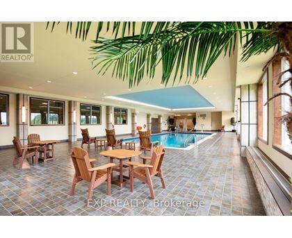 A large room with a pool table and chairs.