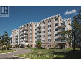 A large apartment building with a clear blue sky in the background.