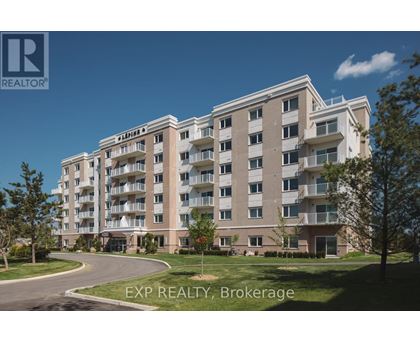 A large apartment building with a clear blue sky in the background.