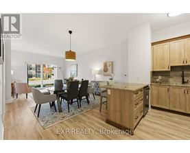A modern kitchen with wooden cabinets and a dining table with chairs.