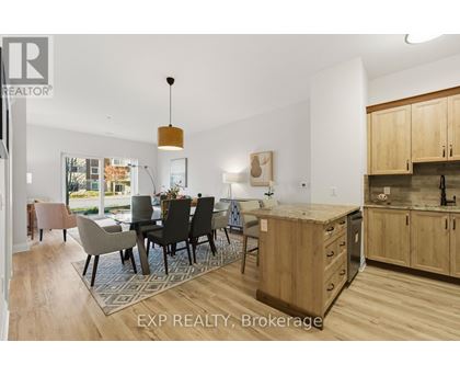A modern kitchen with wooden cabinets and a dining table with chairs.