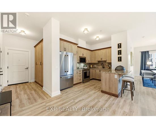 A kitchen with wooden cabinets and a white fridge.