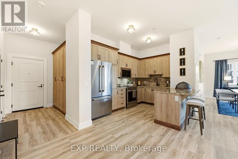 A kitchen with wooden cabinets and a white fridge.