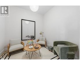 A living room with a couch, chair, and coffee table.