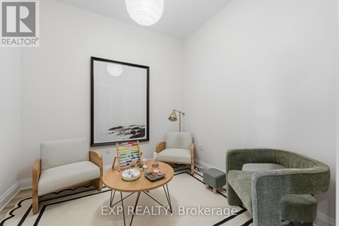 A living room with a couch, chair, and coffee table.