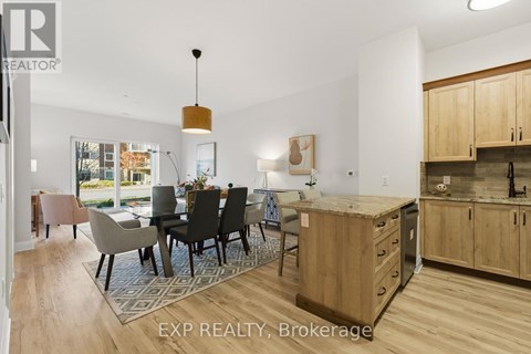 A modern kitchen with wooden cabinets and a dining table with chairs.