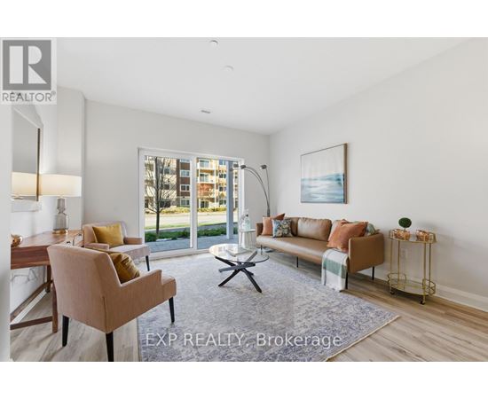 A well-lit living room with a dining table and chairs.