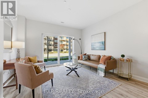 A well-lit living room with a dining table and chairs.