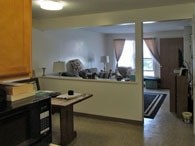 A living room with a couch and a television.