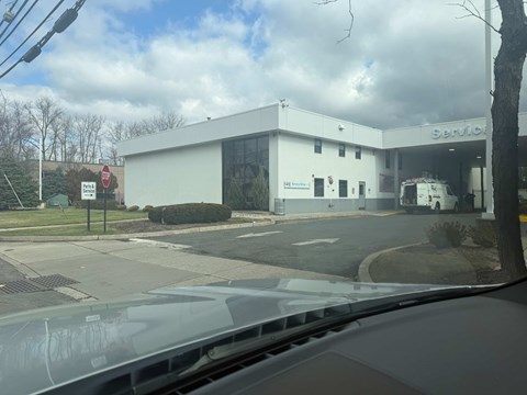A white building with the word "Service" on it.